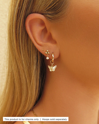 Butterfly Hoop Earring Charm styled in a gold ear stack | The Littl